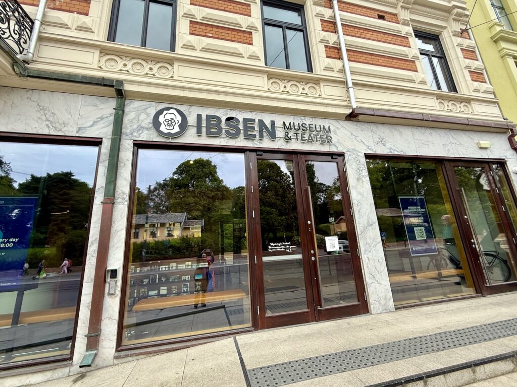 Outside of building with sign "Ibsen Museum & Teater[sic]"