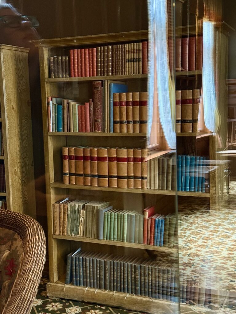One tall bookcase filled with books in Ibsen's library.