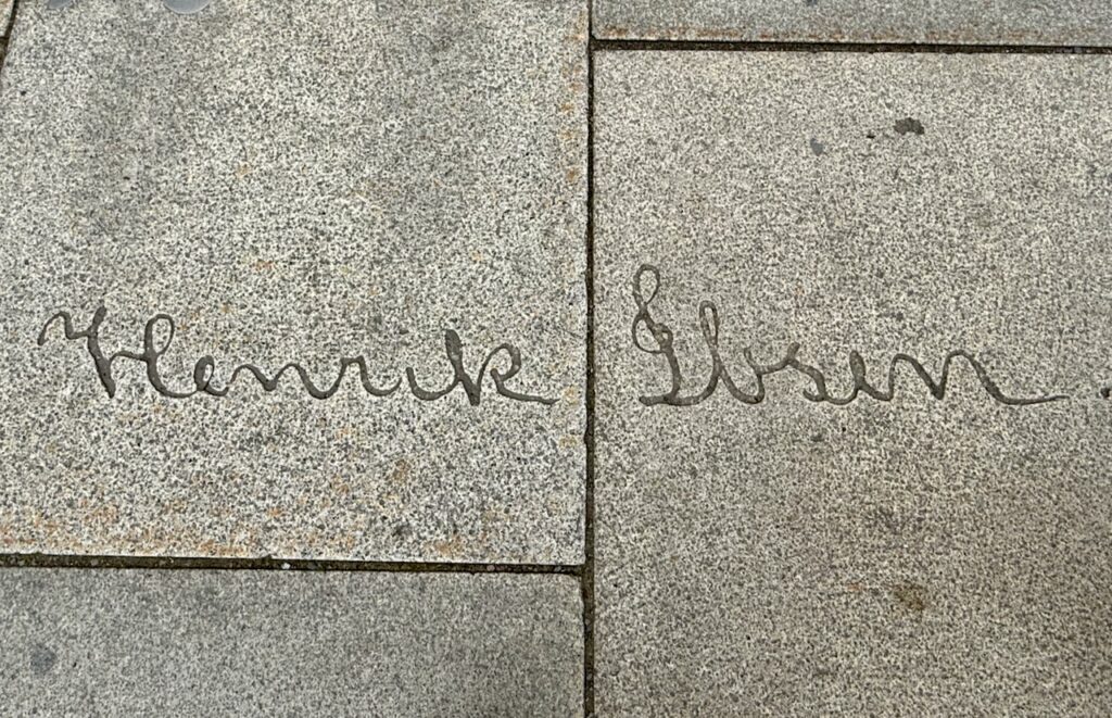 Signature "Henrik Ibsen" on sidewalk outside of Ibsen Museum & Theater.