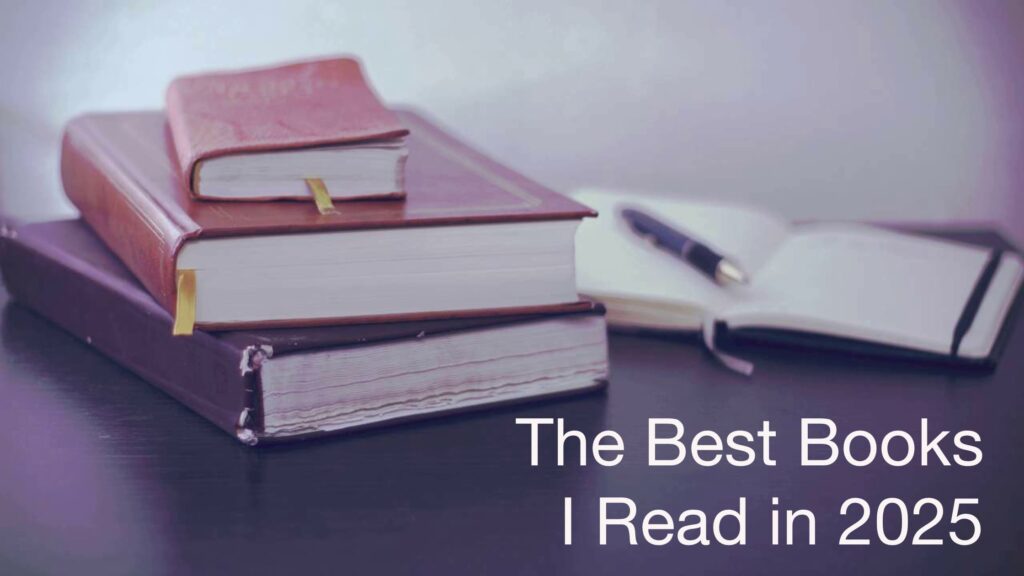 Background: 3 stacked, closed books; open notebook with pen on top. Text: The Best Books I Read in 2025