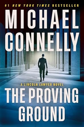 Book cover. Background: a man carrying a briefcase is seen from behind walking toward the entrance of a large building. Text: The Proving Ground by Michael Connelly